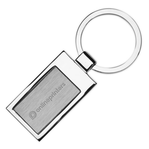 Silverfrgad metallnyckelring i form av en bt med nyckelring.