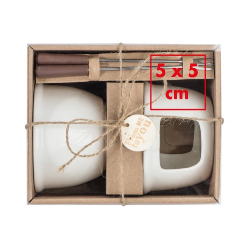 Vitt keramiskt chokladfondue-set med gafflar.