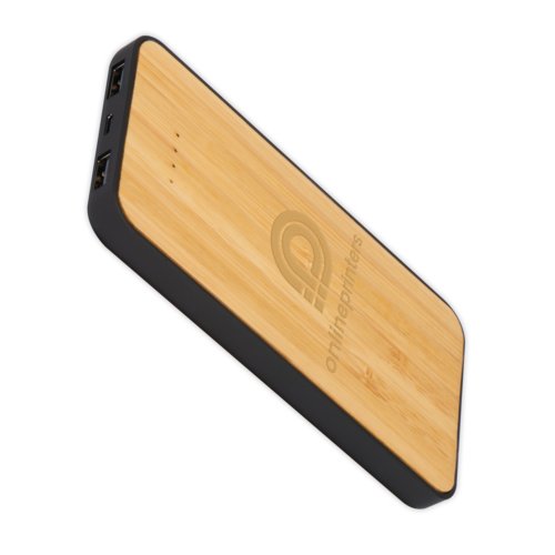 Beige powerbank/trdls laddare i bambu med USB-portar.
