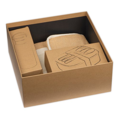 Present set med olika produkter i en lda.