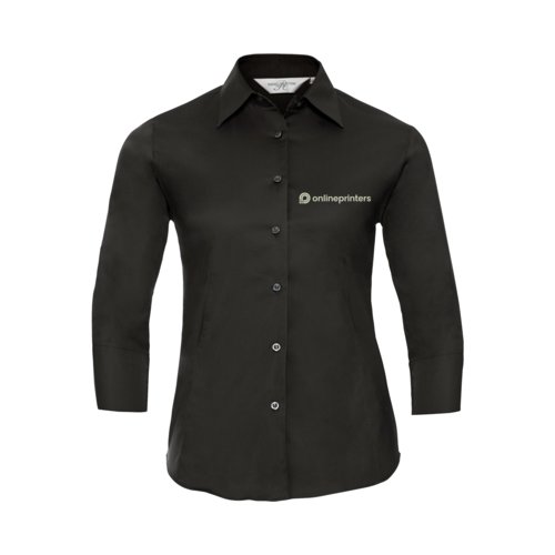 Svart blus med lnga rmar och knappsl.