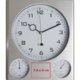 Silverfrgad plastvggklocka med termometer och hygrometer.