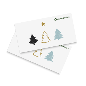 Två vita kort med enkla illustrationer av tre tallar och en stjärna. Träden är svarta, guld och ljusblå, och det finns en grön onlineprinters logotyp i det övre högra hörnet av varje kort.